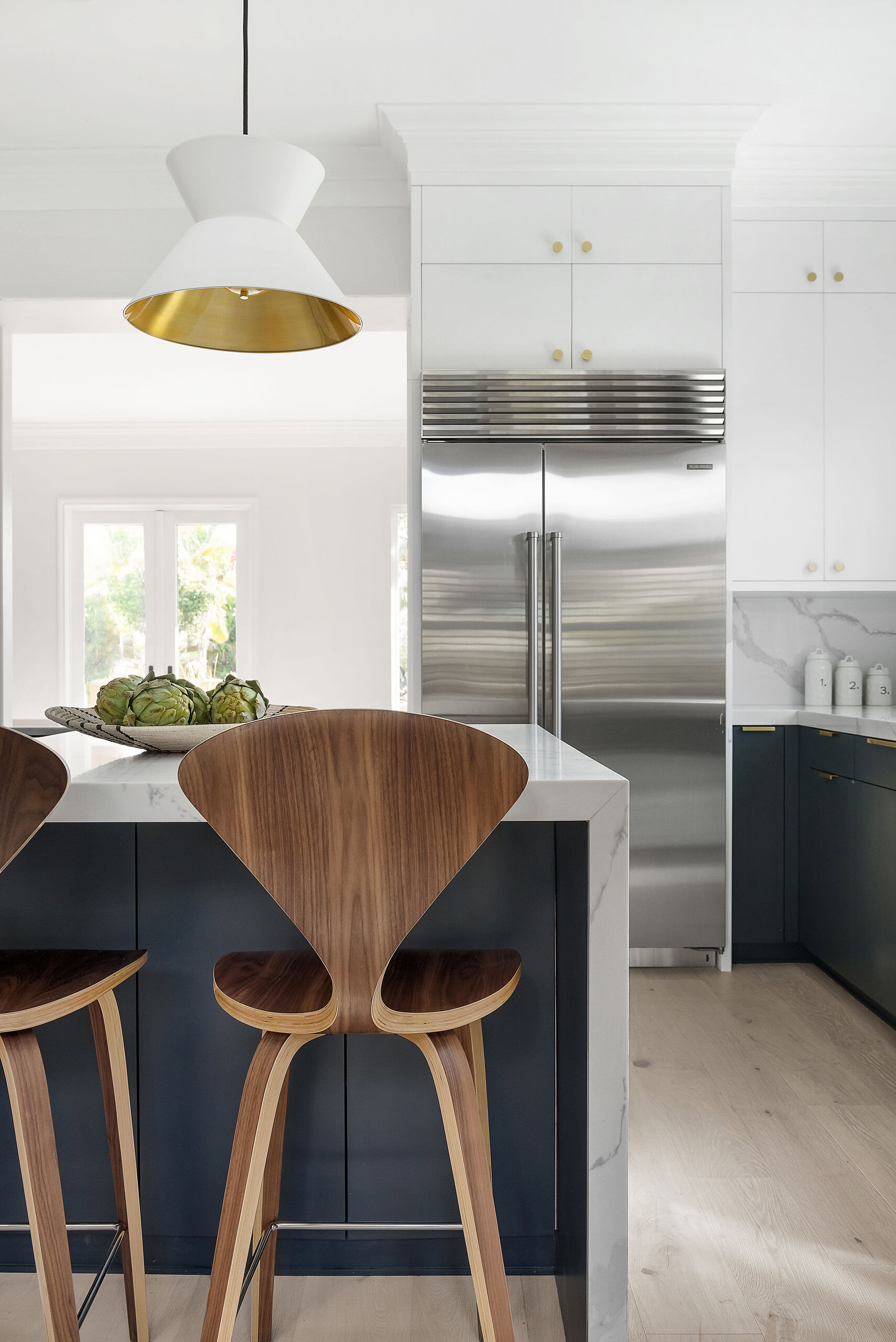 Contemporary Point Loma kitchen featuring stylish cabinetry, stainless steel refrigerator, and elega.