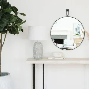 Stylish round wall mirror ideal for contemporary interior design. Perfect for enhancing space and li.