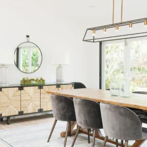 Elegant dining room with stylish rugs, modern lighting, and contemporary furniture. Perfect for cozy.