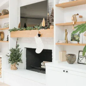Elegant holiday decor with a Christmas stocking hanging over the fireplace.