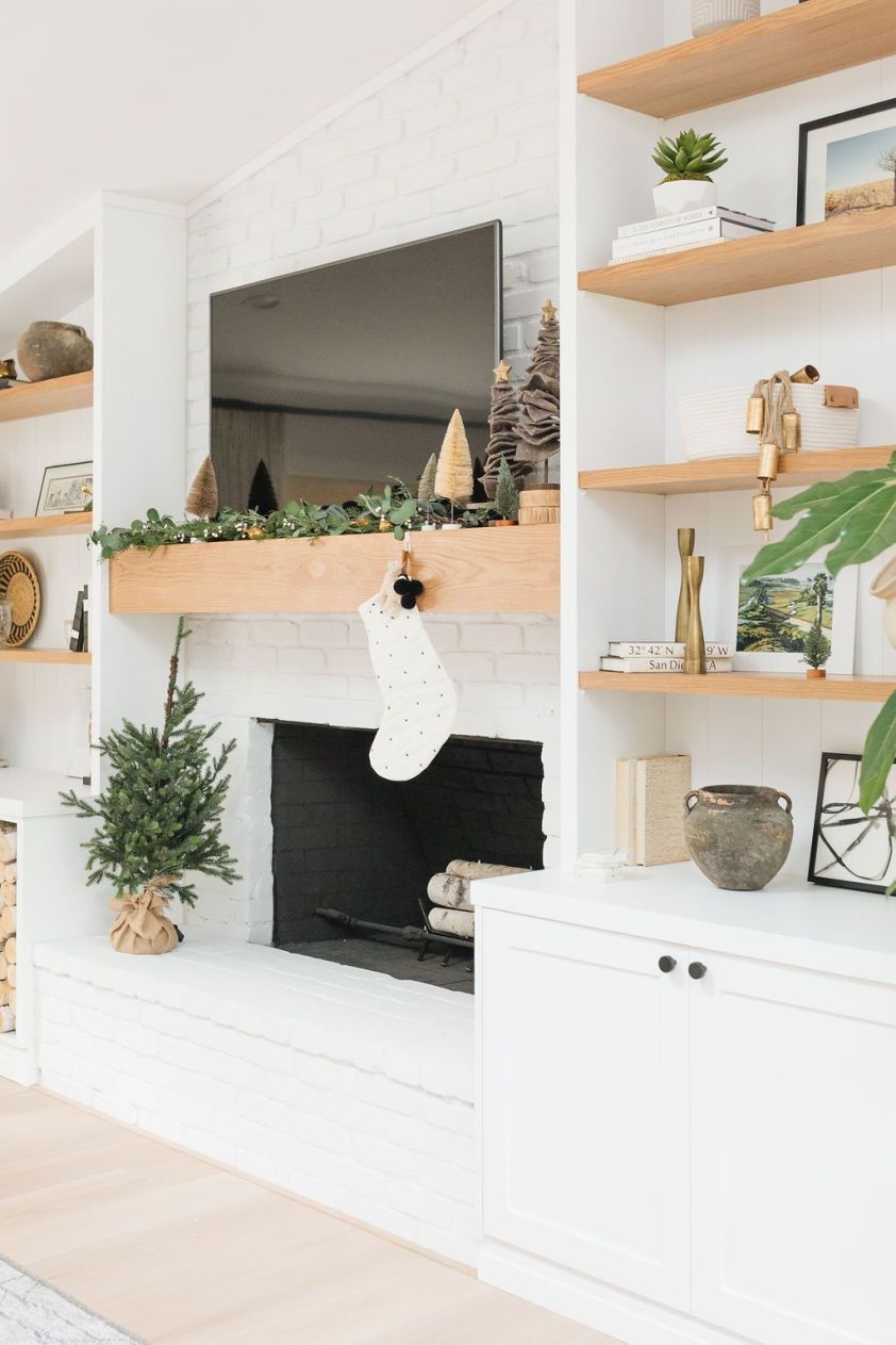 Elegant holiday decor with a Christmas stocking hanging over the fireplace.