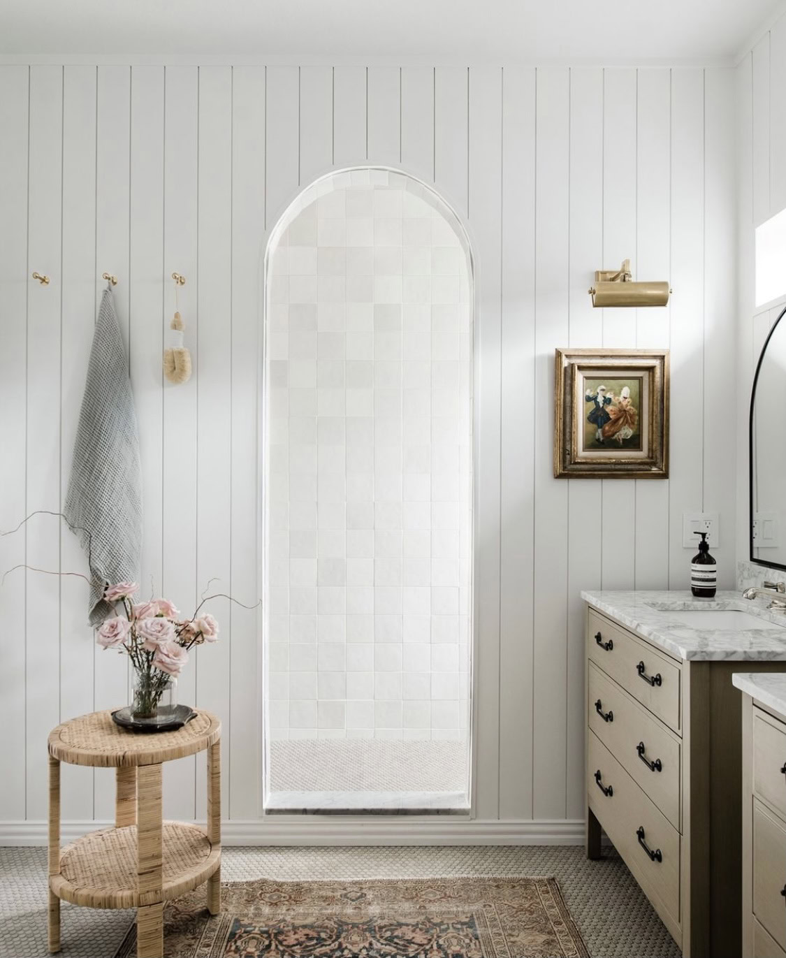 Bright coastal white bathroom with elegant decor and natural light.
