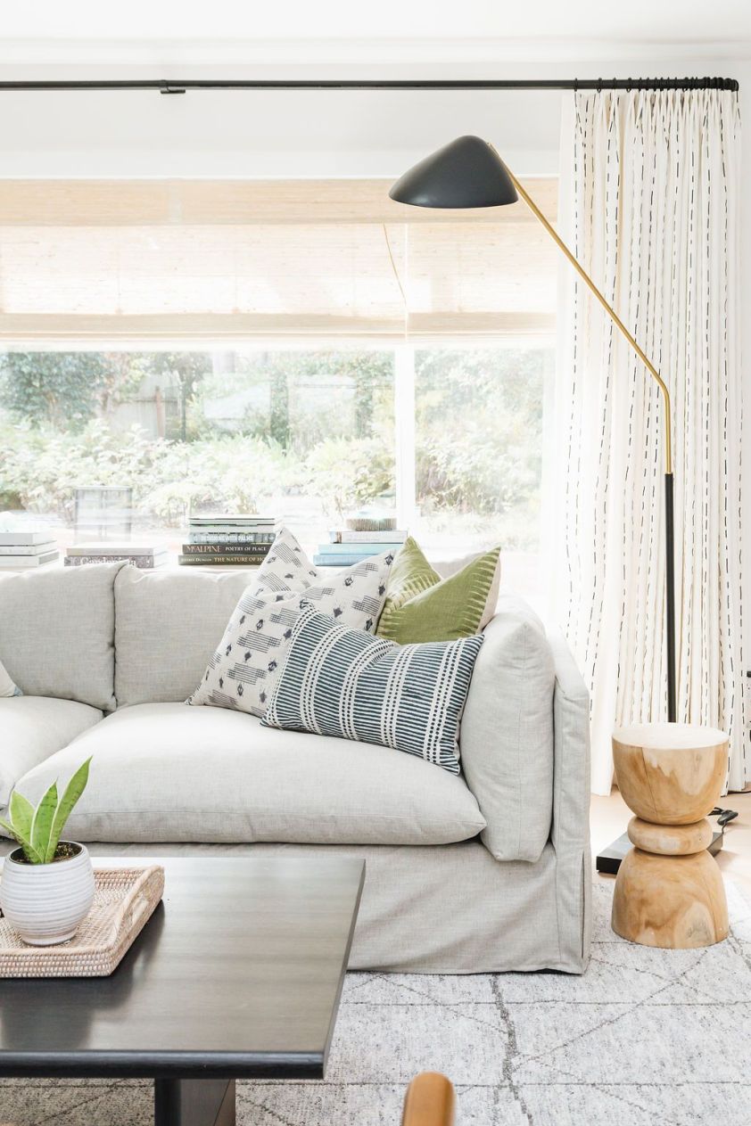 Stylish pillows on a cozy sofa in a bright living room, perfect for relaxing and decorating with int.
