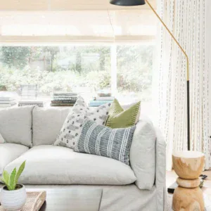 Stylish pillows on a cozy sofa in a bright living room, perfect for relaxing and decorating with int.
