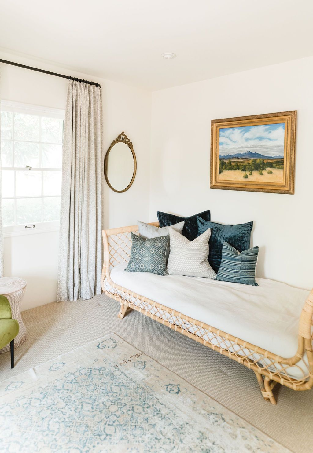 Stylish bedroom with decorative pillows and classic decor for a cozy, inviting space.