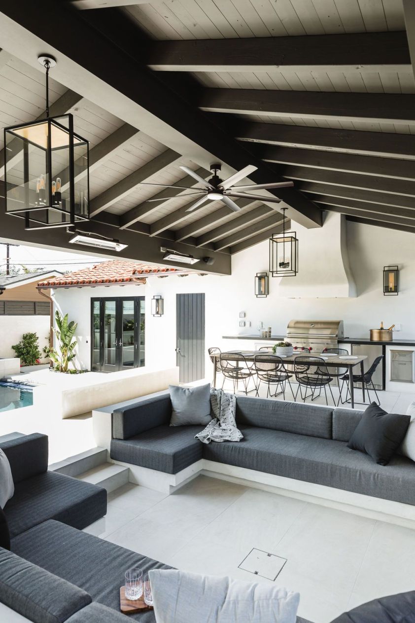 Modern outdoor living space with stylish furniture and lighting.