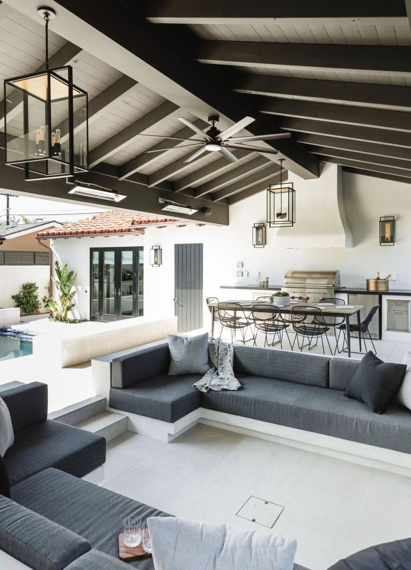 Inviting outdoor lounge area featuring contemporary furniture and stylish lighting. Perfect for rela.
