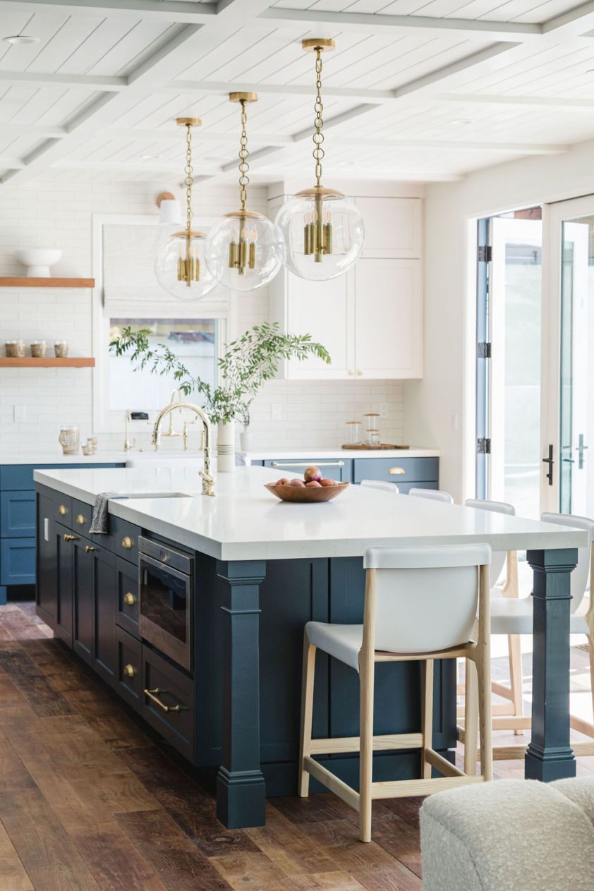Ceiling design featuring stylish pendant lights in a contemporary kitchen setting.