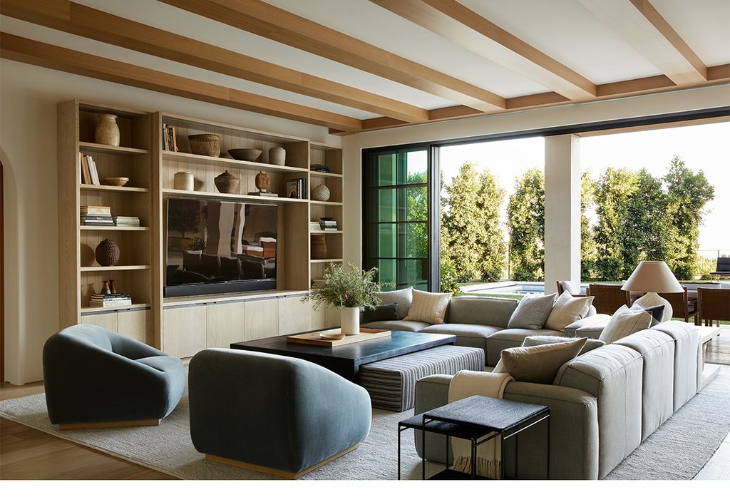 Elegant living room showcasing a creative ceiling with wooden beams and modern decor.