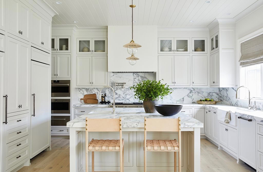 Modern kitchen with stylish ceiling detail and bright white cabinetry.