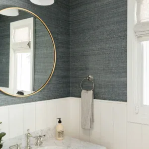 Modern bathroom featuring stylish grasscloth wallpaper and contemporary fixtures.