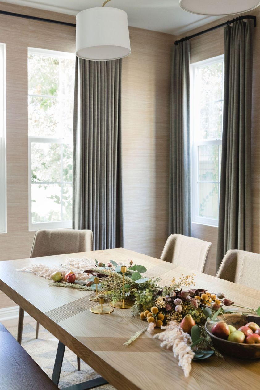 Holiday tablescape with fresh fruit and seasonal decor for festive gatherings.