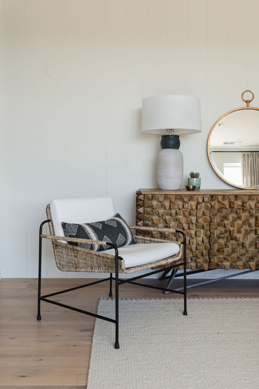 Elegant table lamp with a white shade and textured base for stylish lighting.