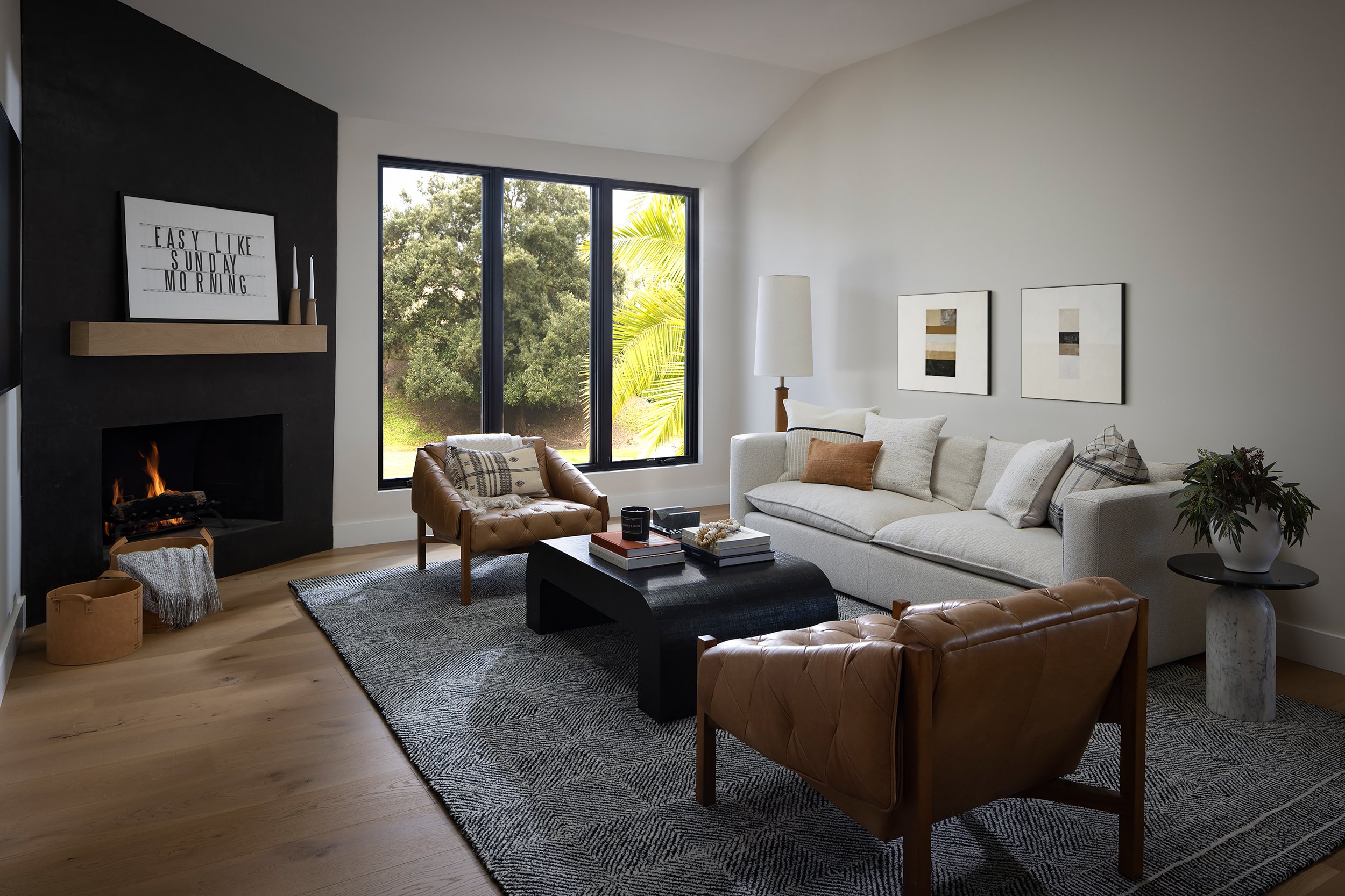 Stylish living room featuring contemporary furniture and a large window with scenic outdoor views.