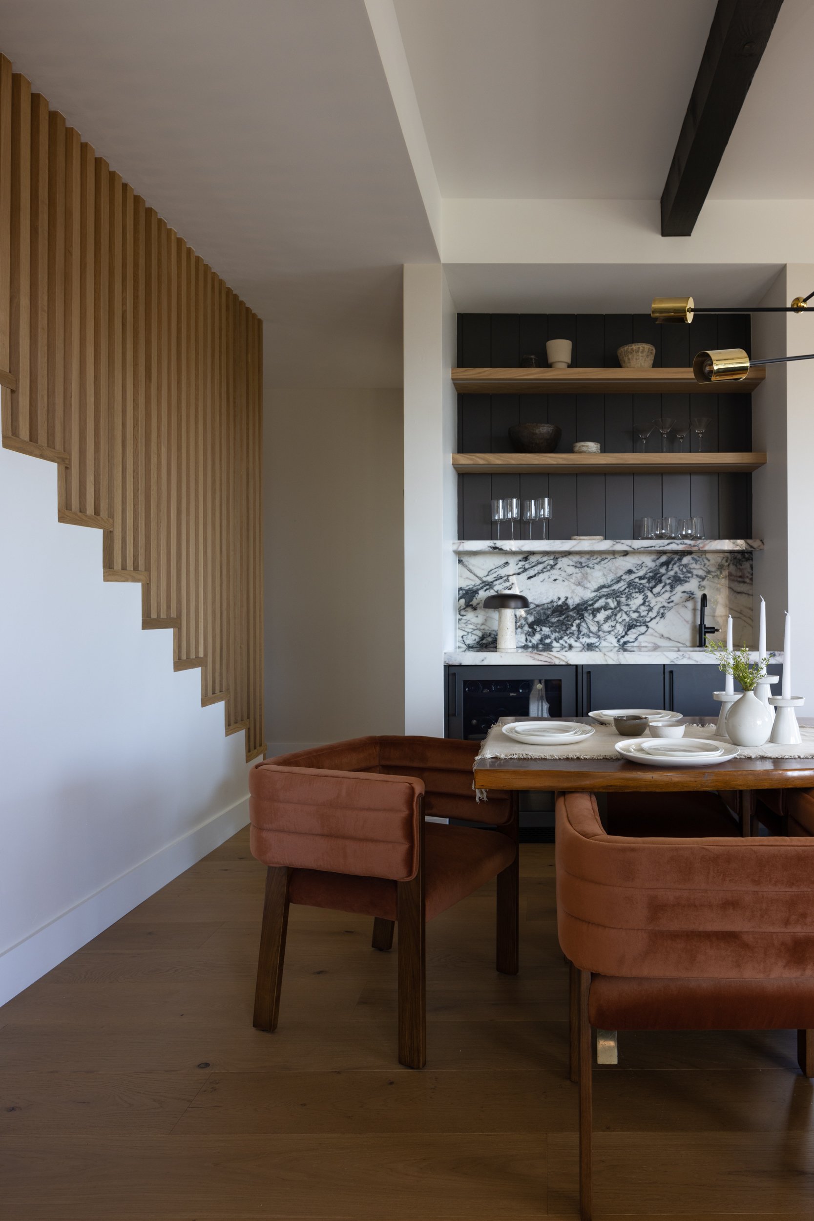 Contemporary Thunderbird interior featuring wooden accents and a stylish dining area.