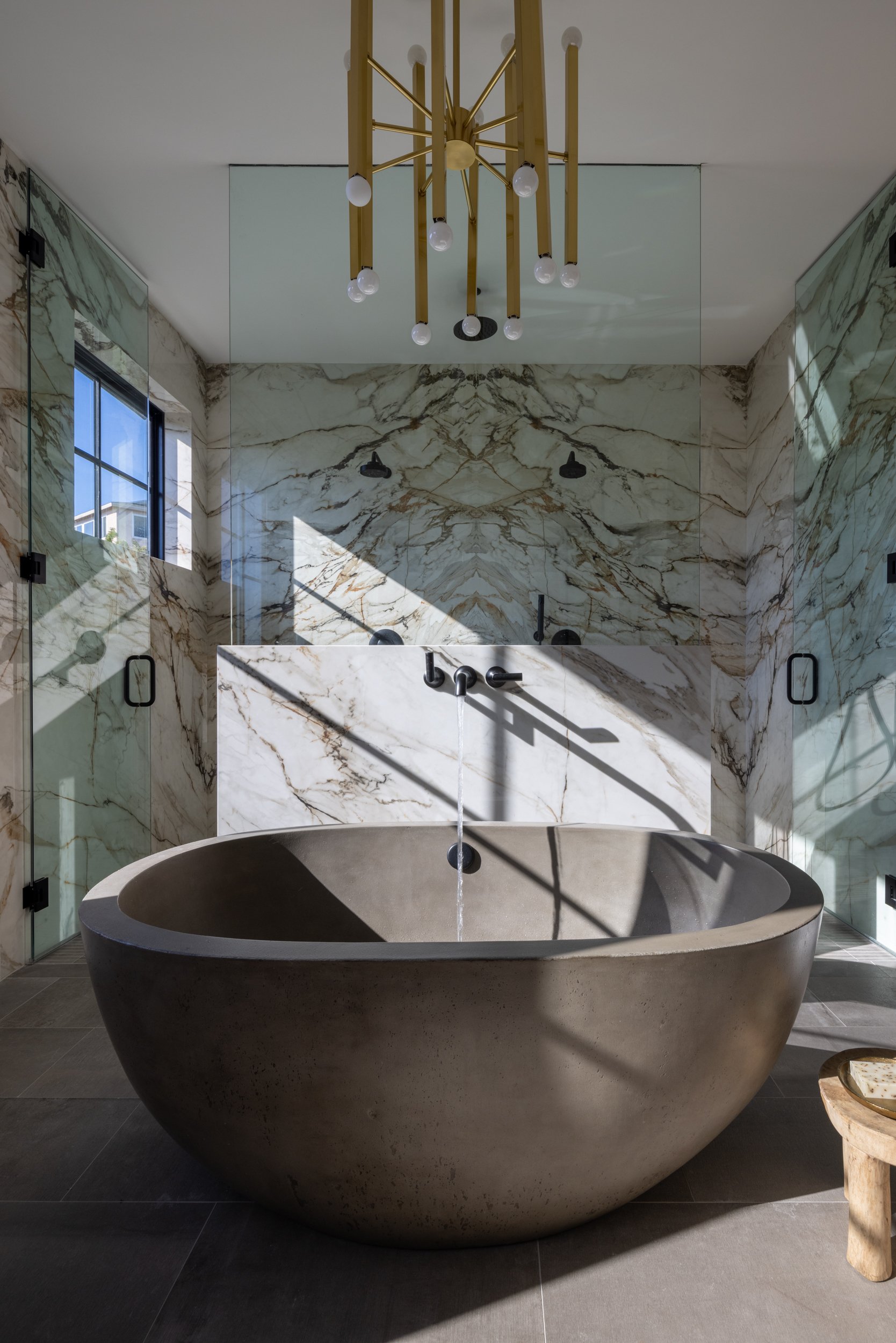 Elegant marble bathtub with sleek design in contemporary bathroom setting.