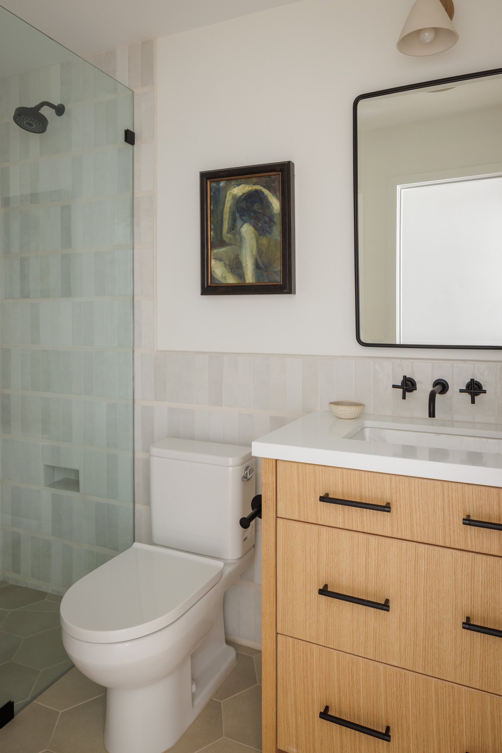 Bathroom with modern fixtures and minimalist decor.