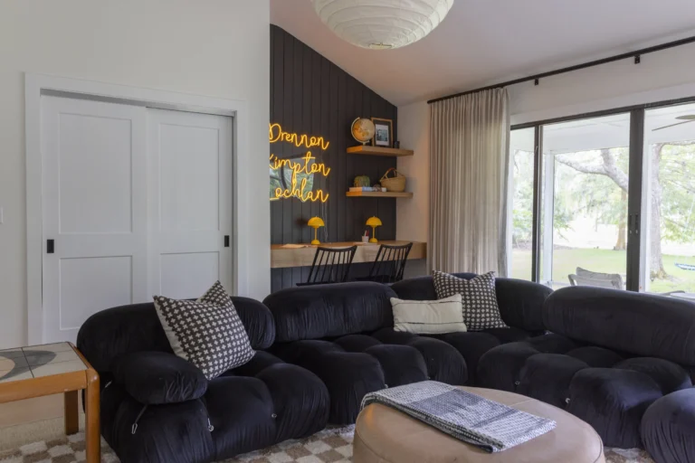 Modern living room with stylish furniture and decor accents.