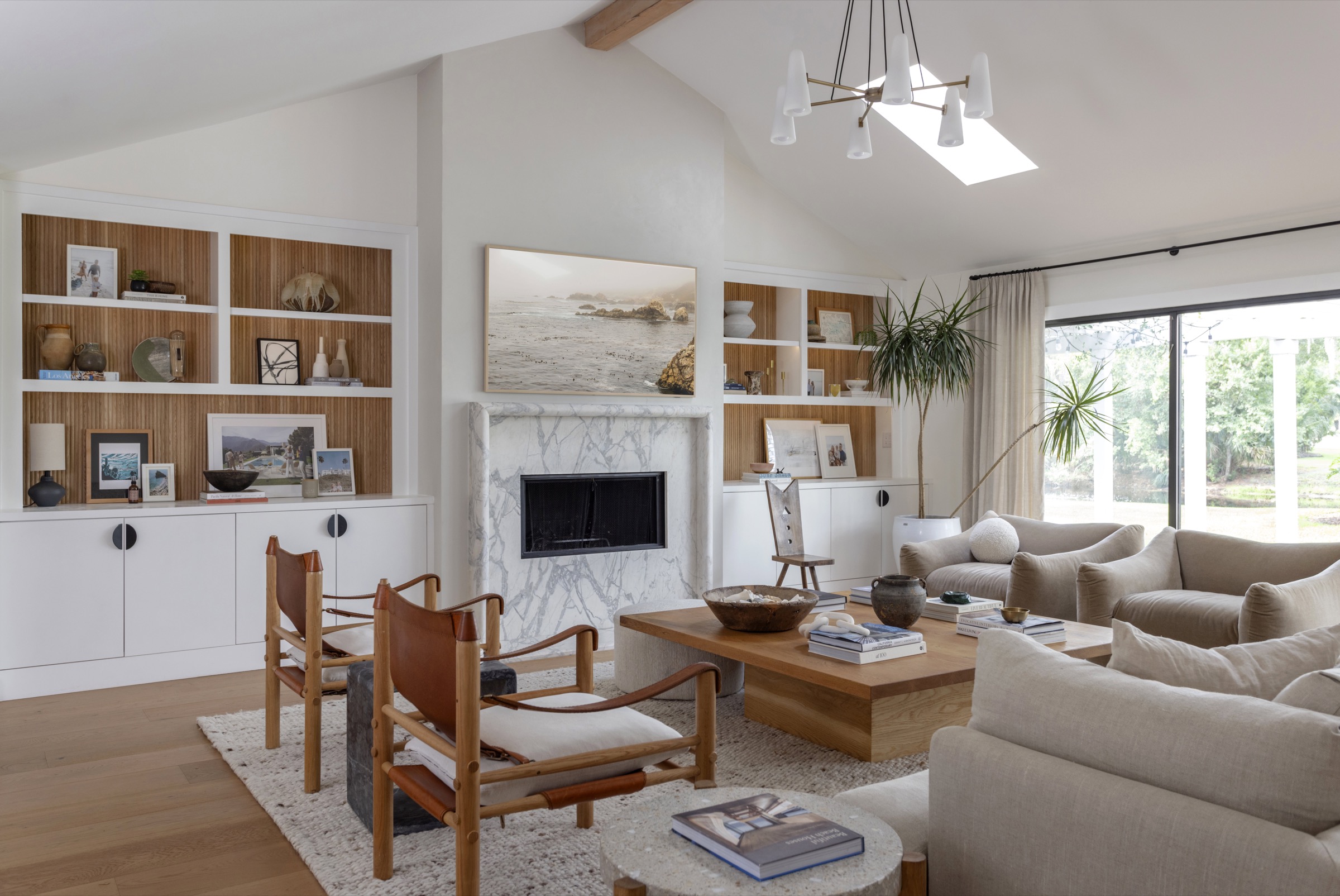 Bright coastal living room with natural light and stylish decor.