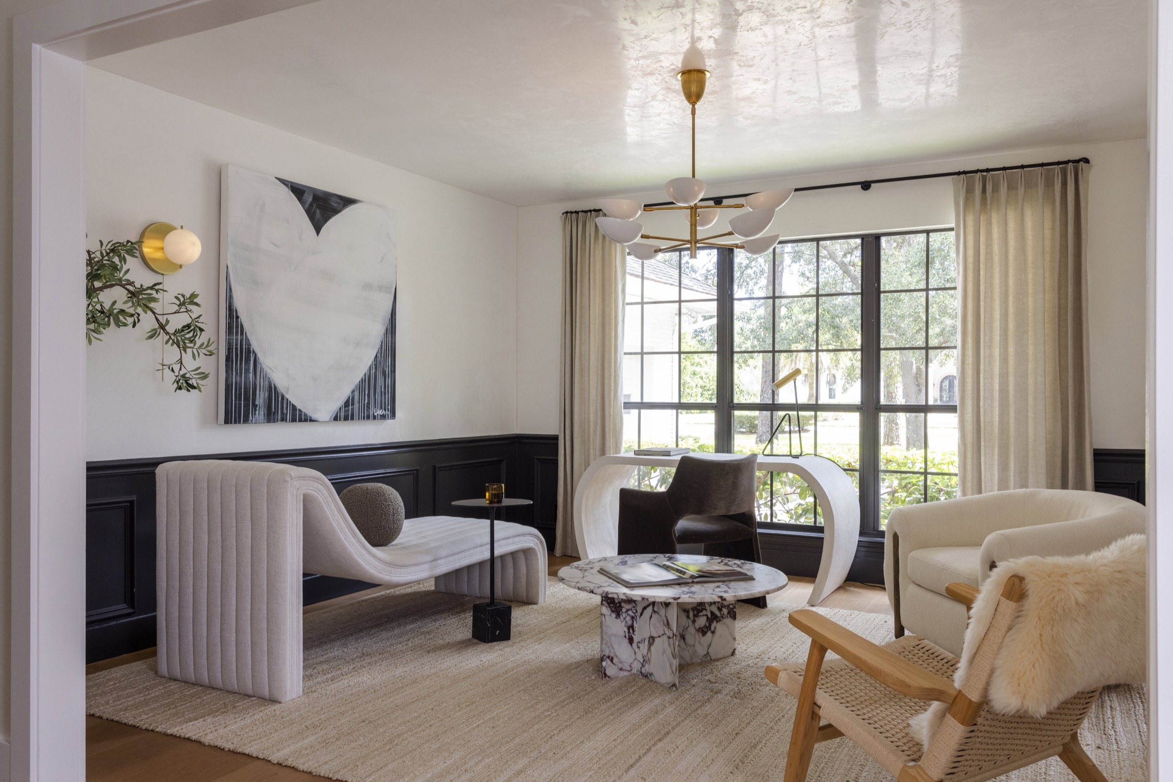 Bright and airy interior with modern furniture and large windows in Ponte Vedra Beach.