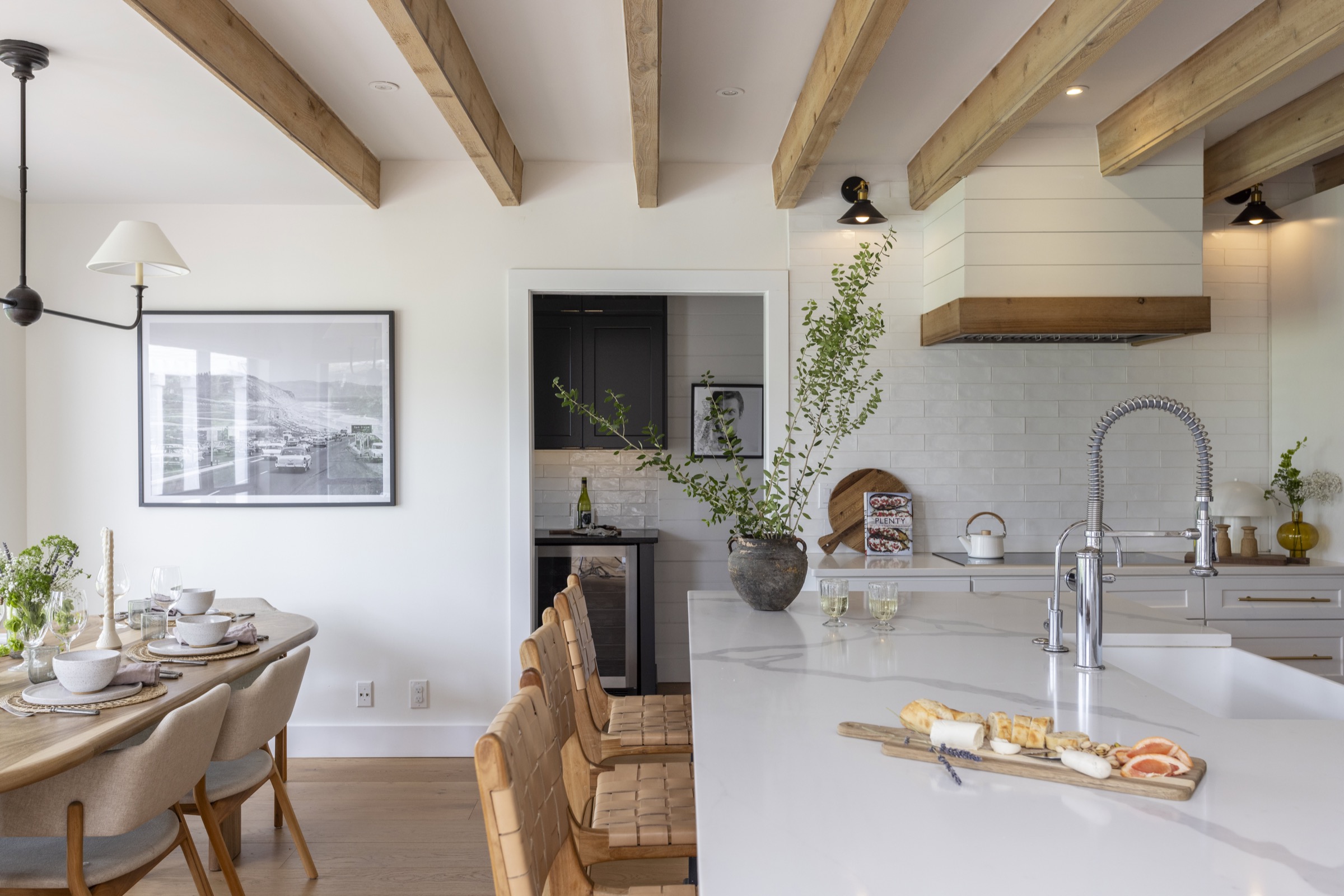 Elegant kitchen with white cabinetry and wooden accents, perfect for coastal living.