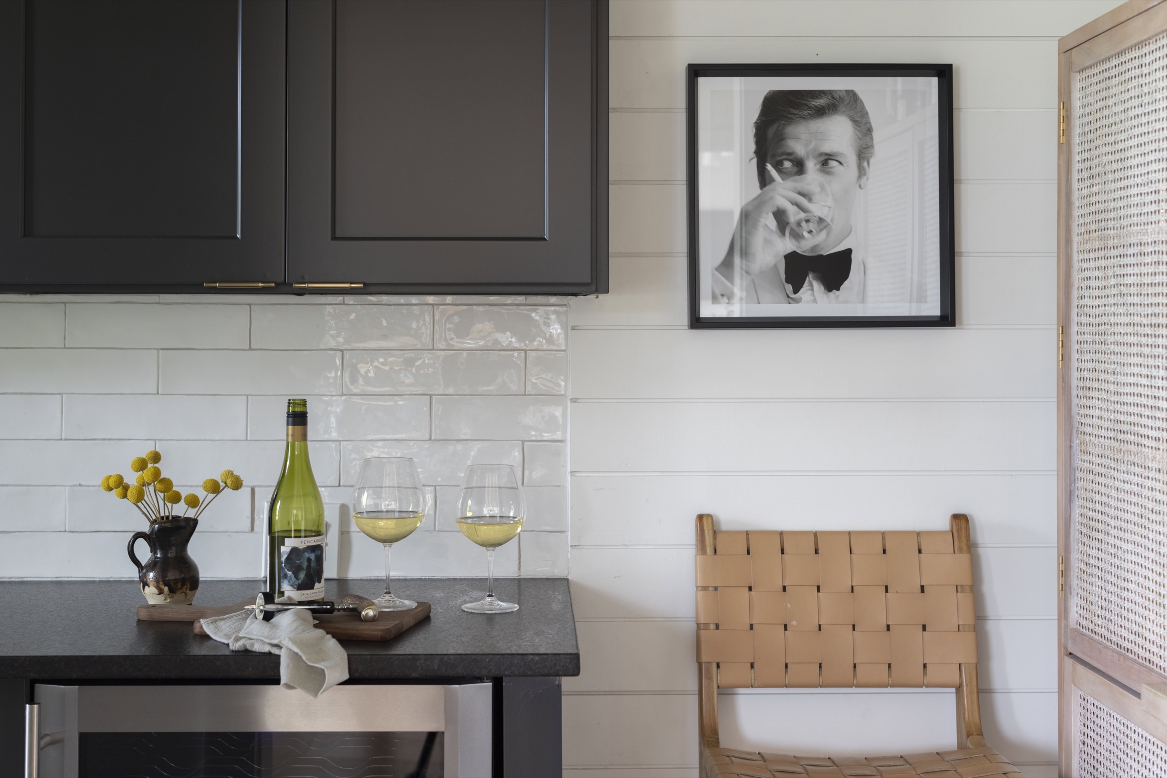 Elegant coastal kitchen with modern cabinetry and stylish decor.