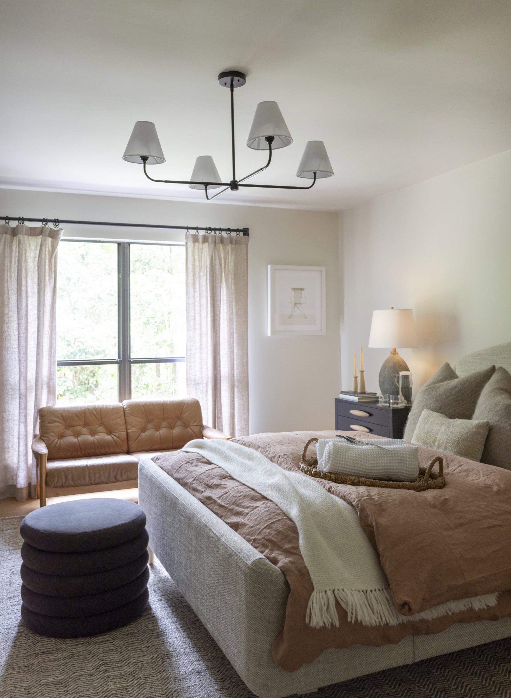 Elegant bedroom with neutral tones, soft lighting, and stylish furniture for relaxing living spaces.