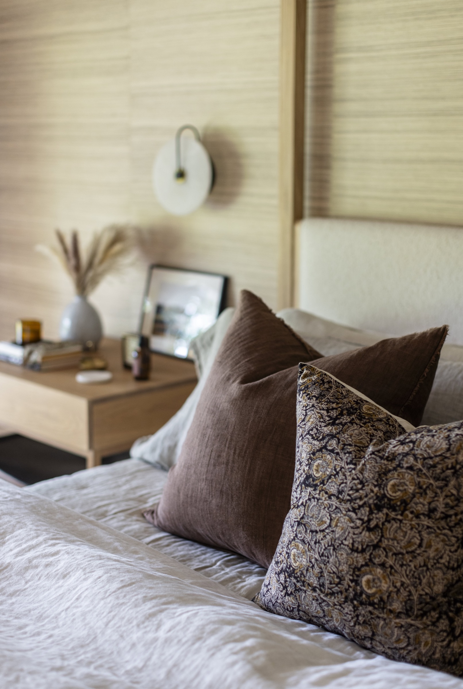 Luxurious bedroom decor with soft pillows and stylish accents.