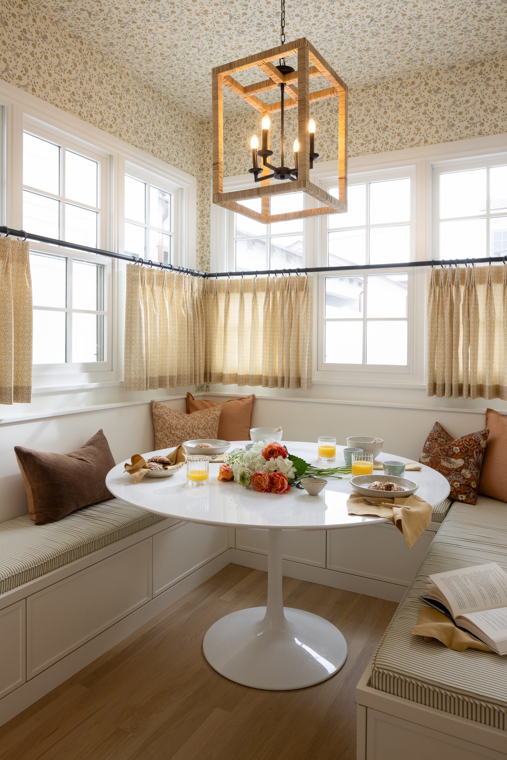 Cozy breakfast nook with natural light and elegant decor.