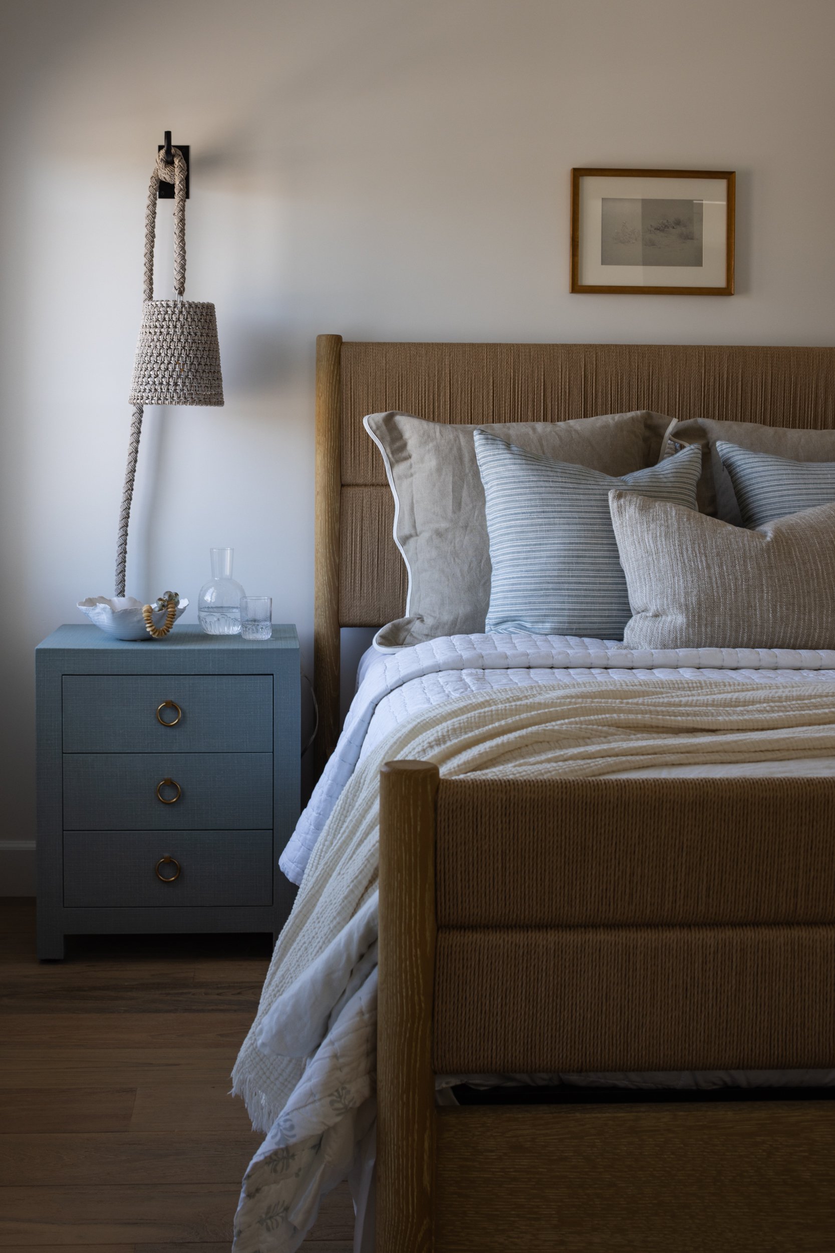 Neptune bedroom interior with cozy bedding and modern decor.