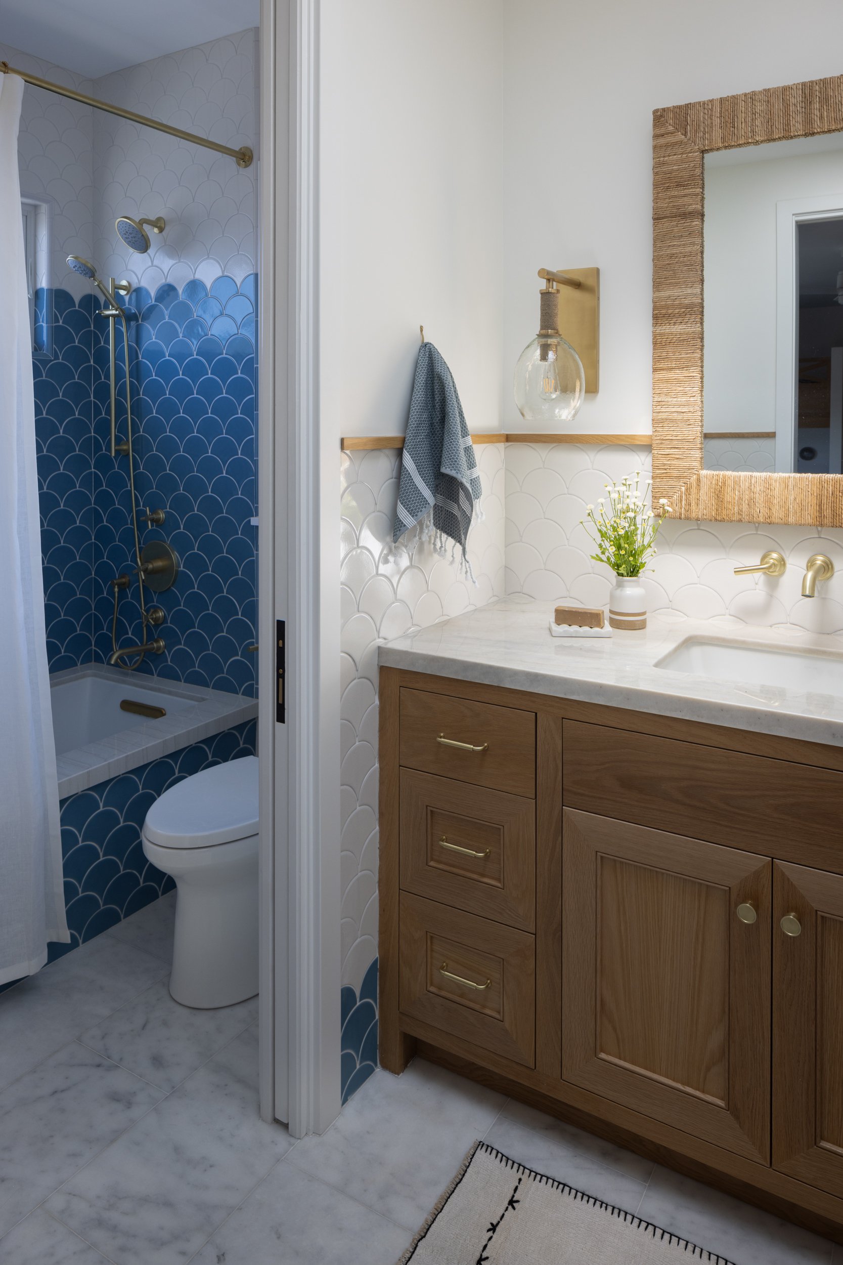 Elegant Neptune-themed bathroom with stylish blue tiles and modern fixtures.