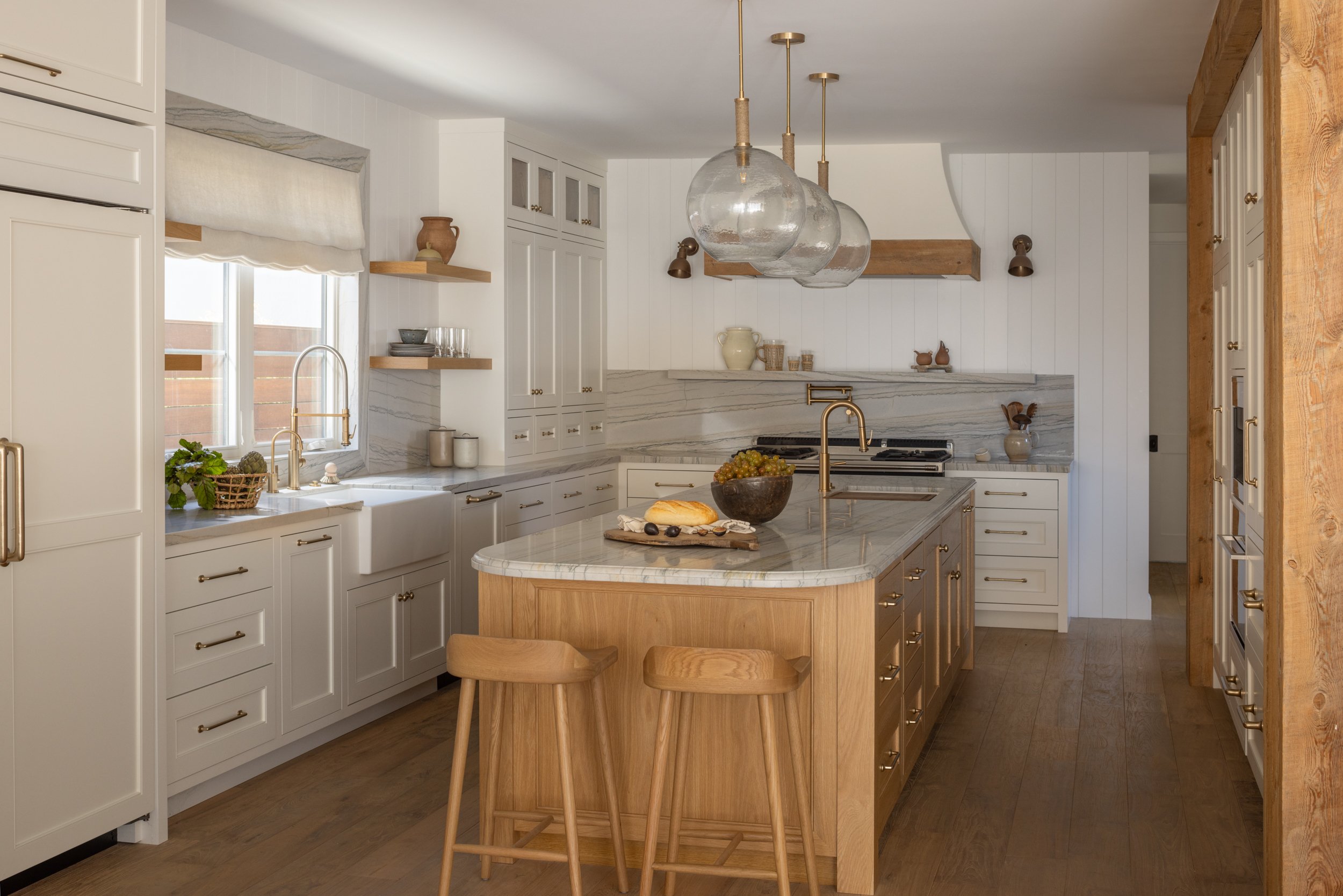 Modern white kitchen with wooden accents and island, inspired by Neptune design.