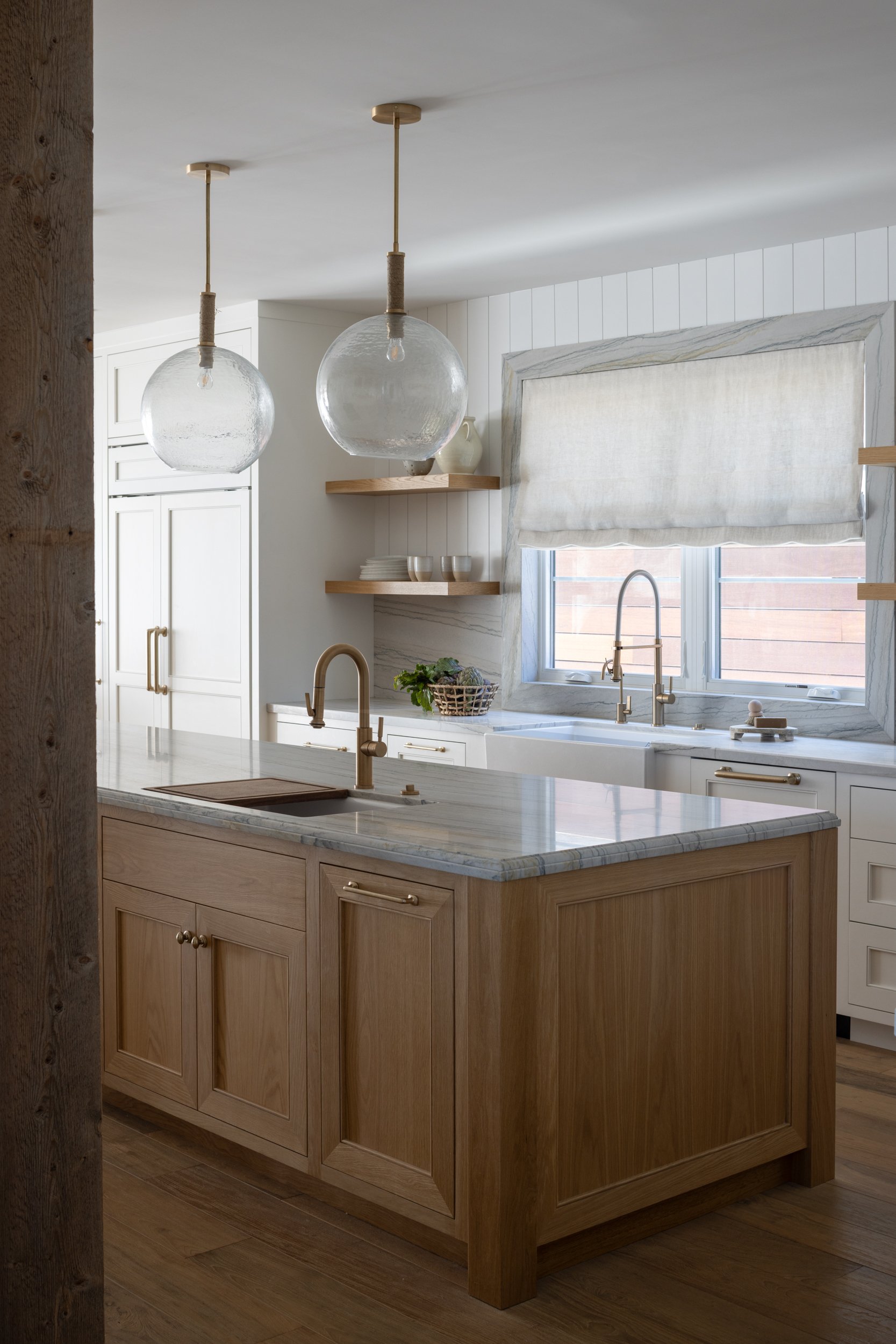 Neptune-themed kitchen with natural wood finishes and elegant fixtures.
