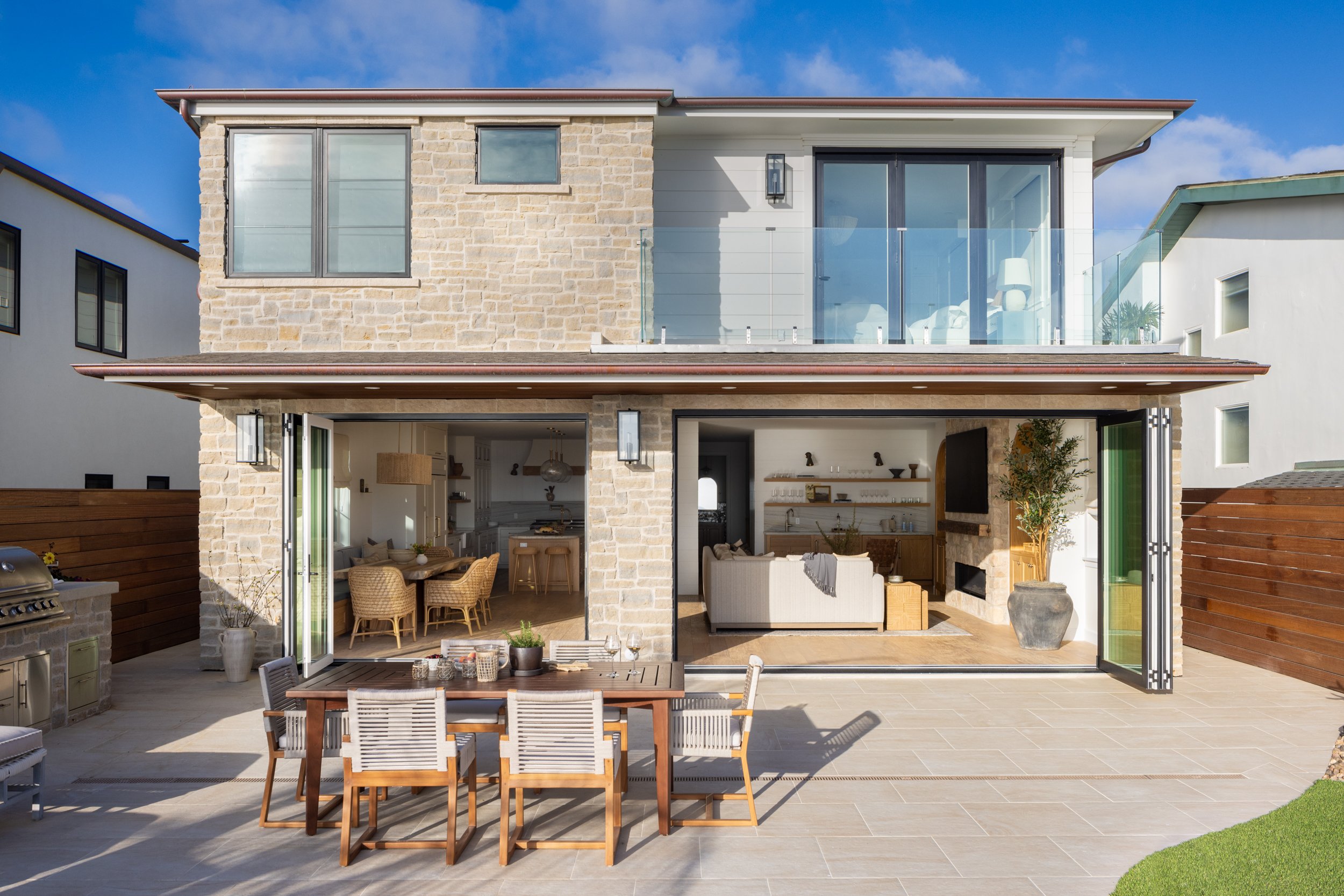 Neptune-themed modern home with outdoor dining and sleek interior decor.