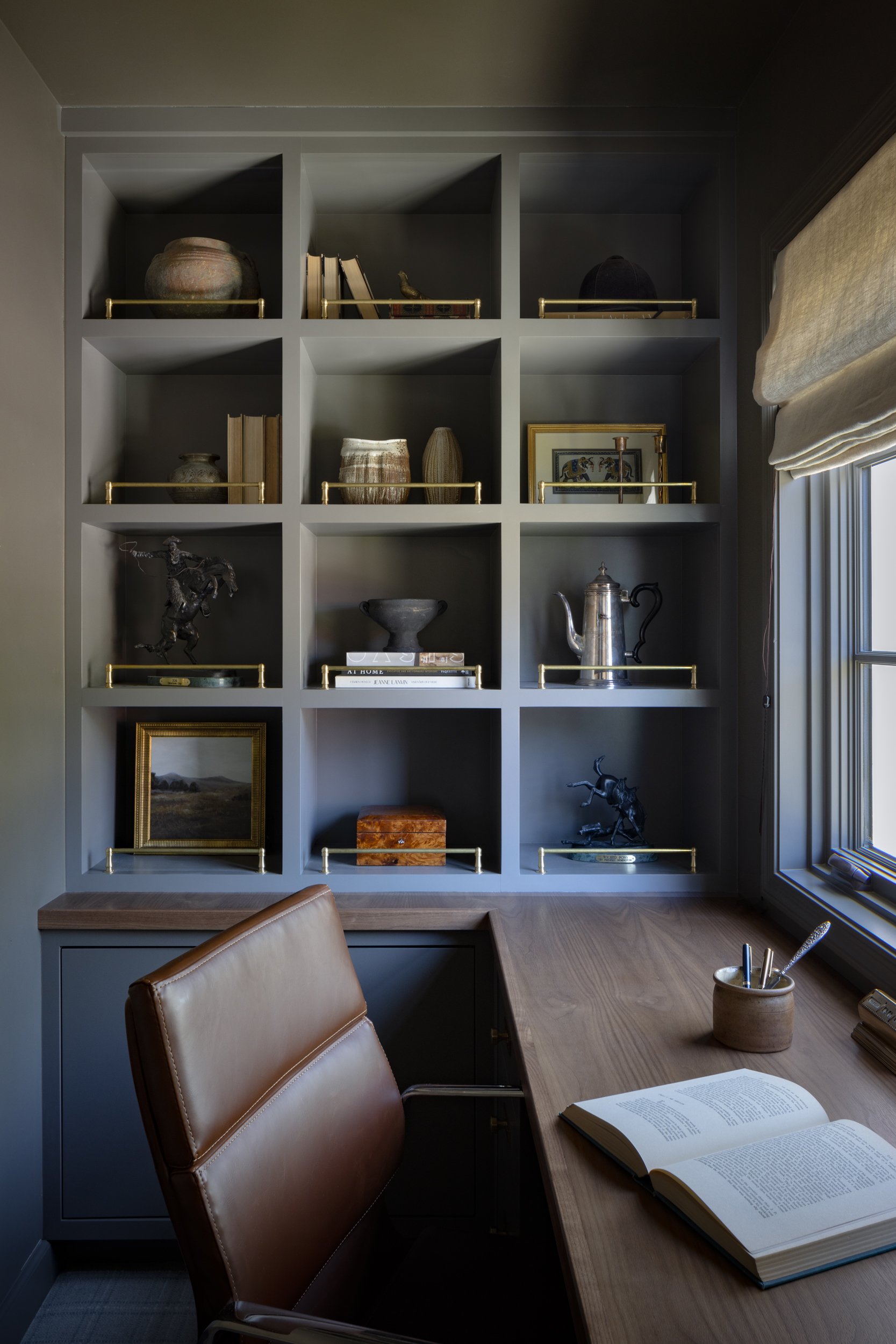 Modern interior design emphasizing stylish storage and cozy workspace.