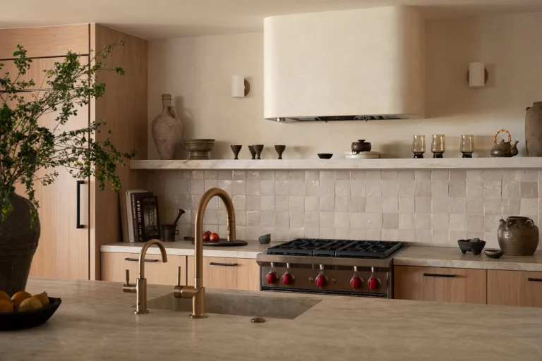 Elegant kitchen design featuring wooden cabinetry, a sleek countertop, and minimalist decor for a co.