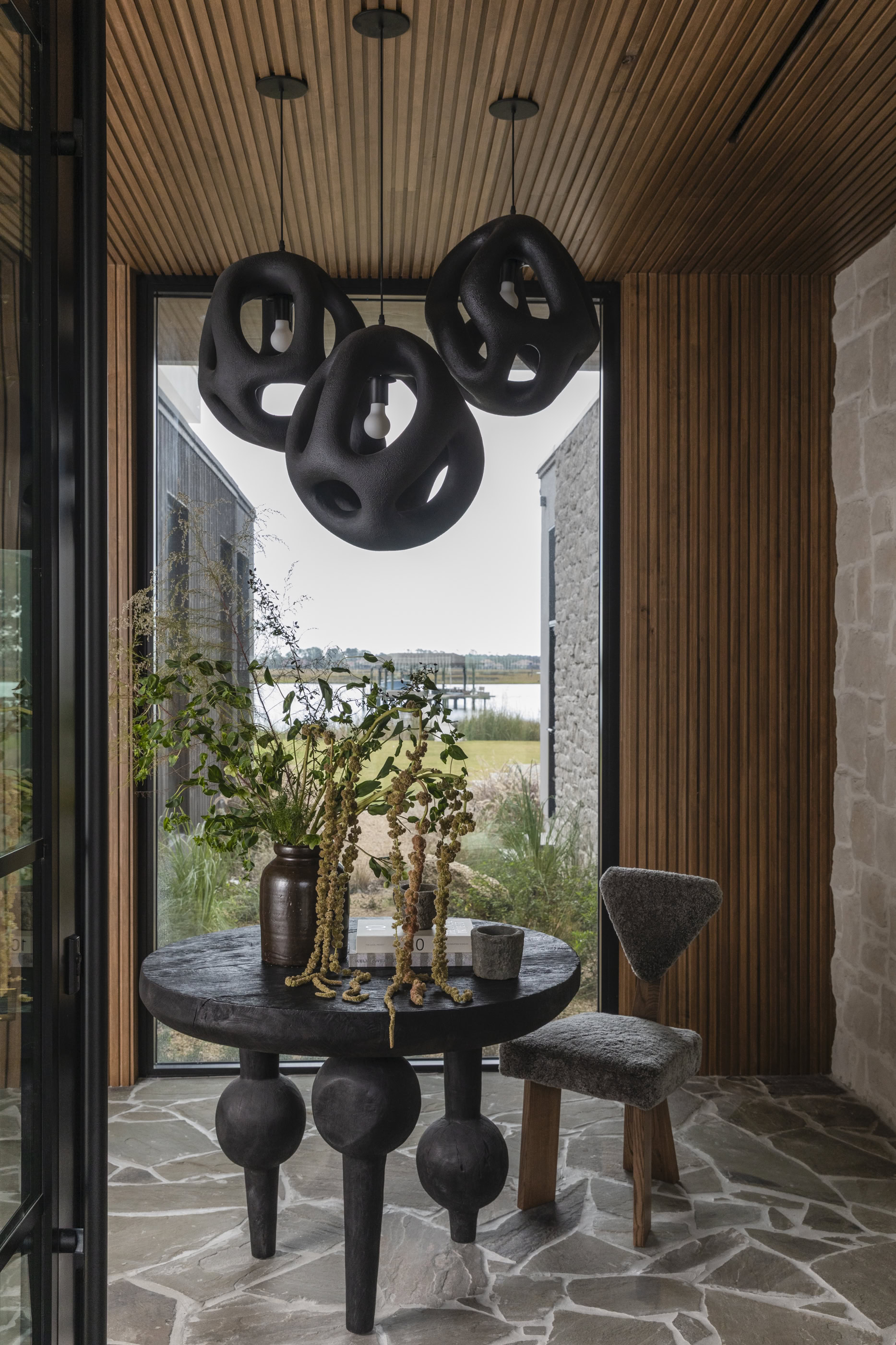 Interior design featuring contemporary decor and statement black pendant lights.