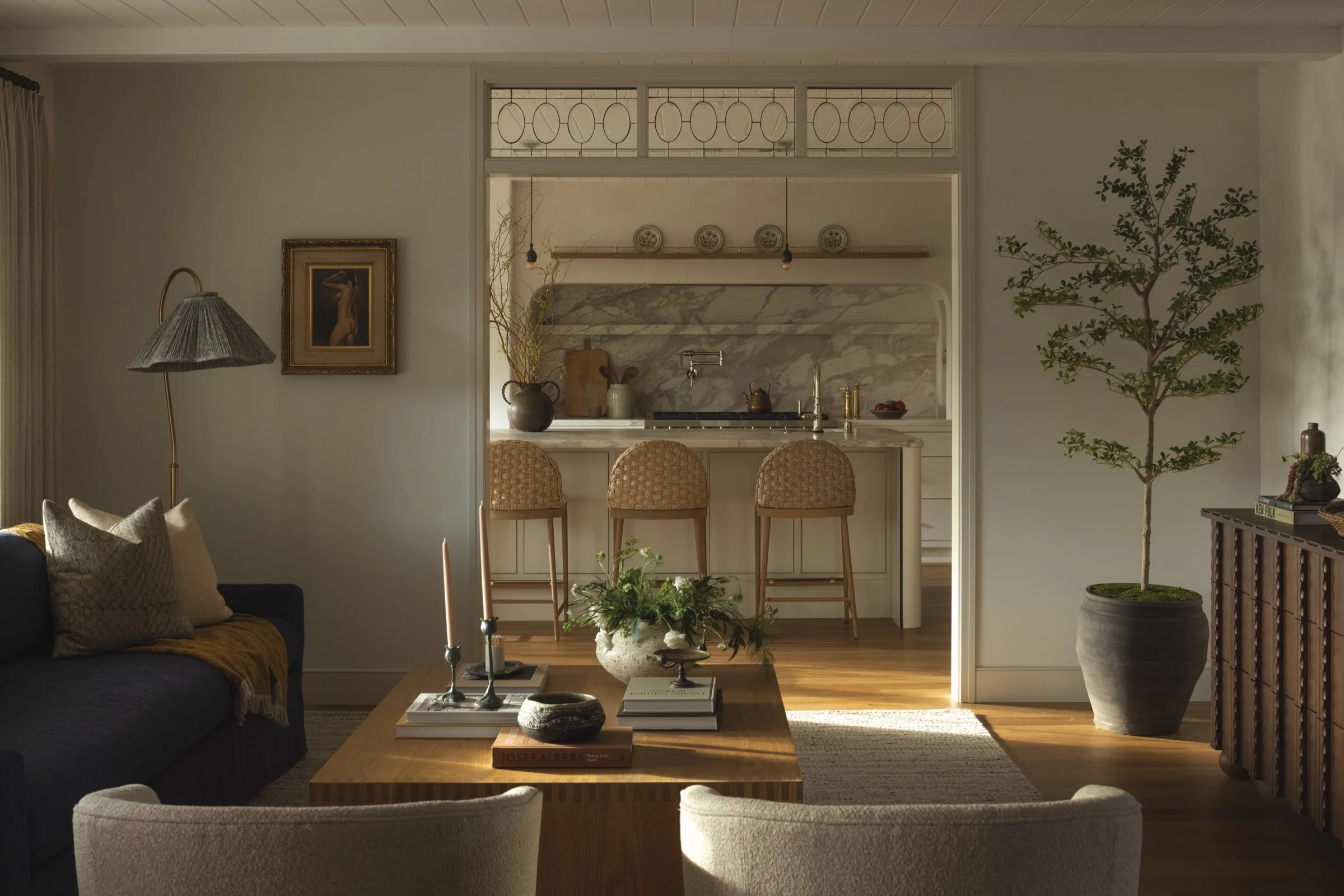 Elegant living room with modern decor and natural lighting.