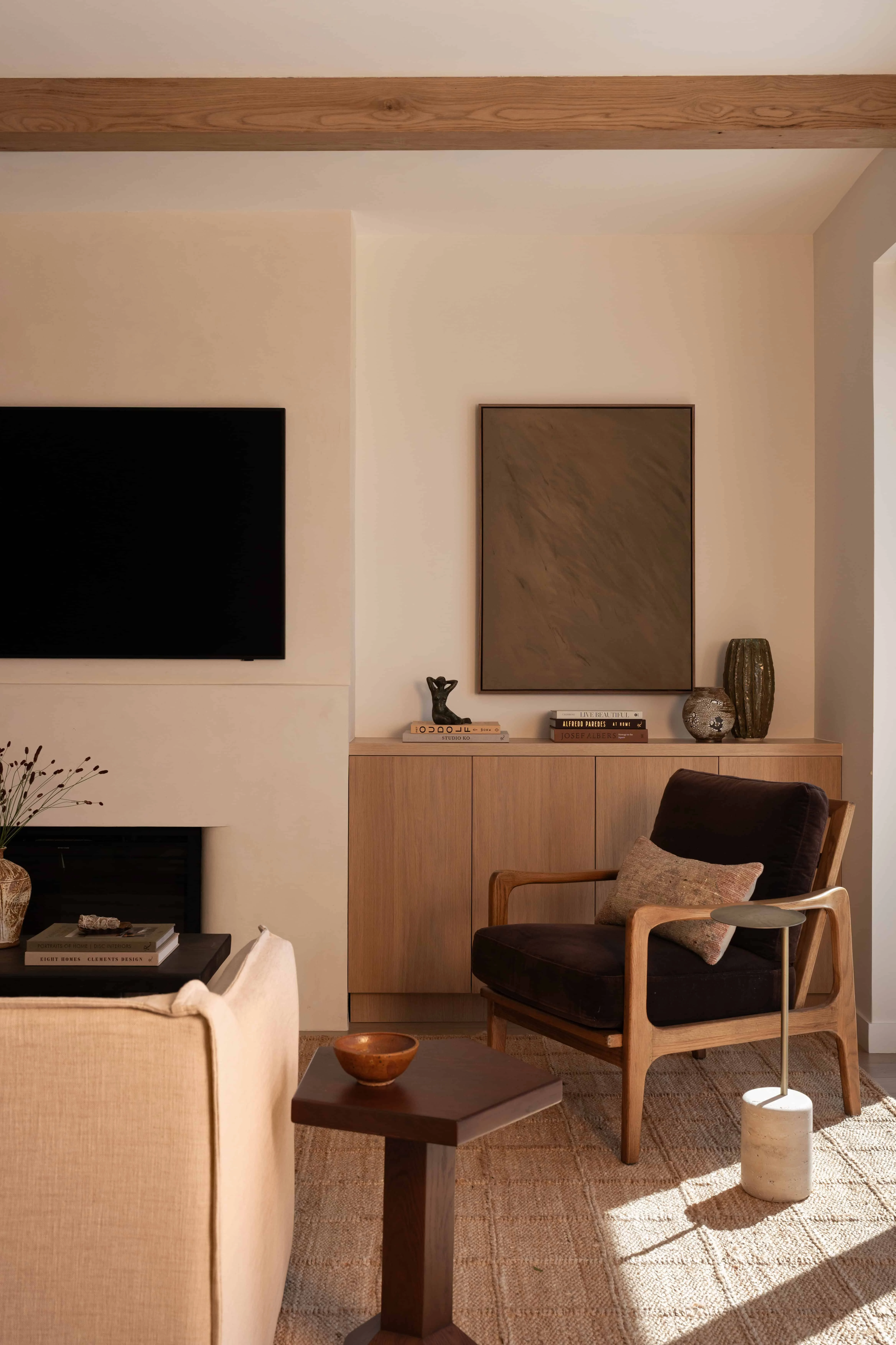 Modern living room with minimalist decor and natural wood accents.