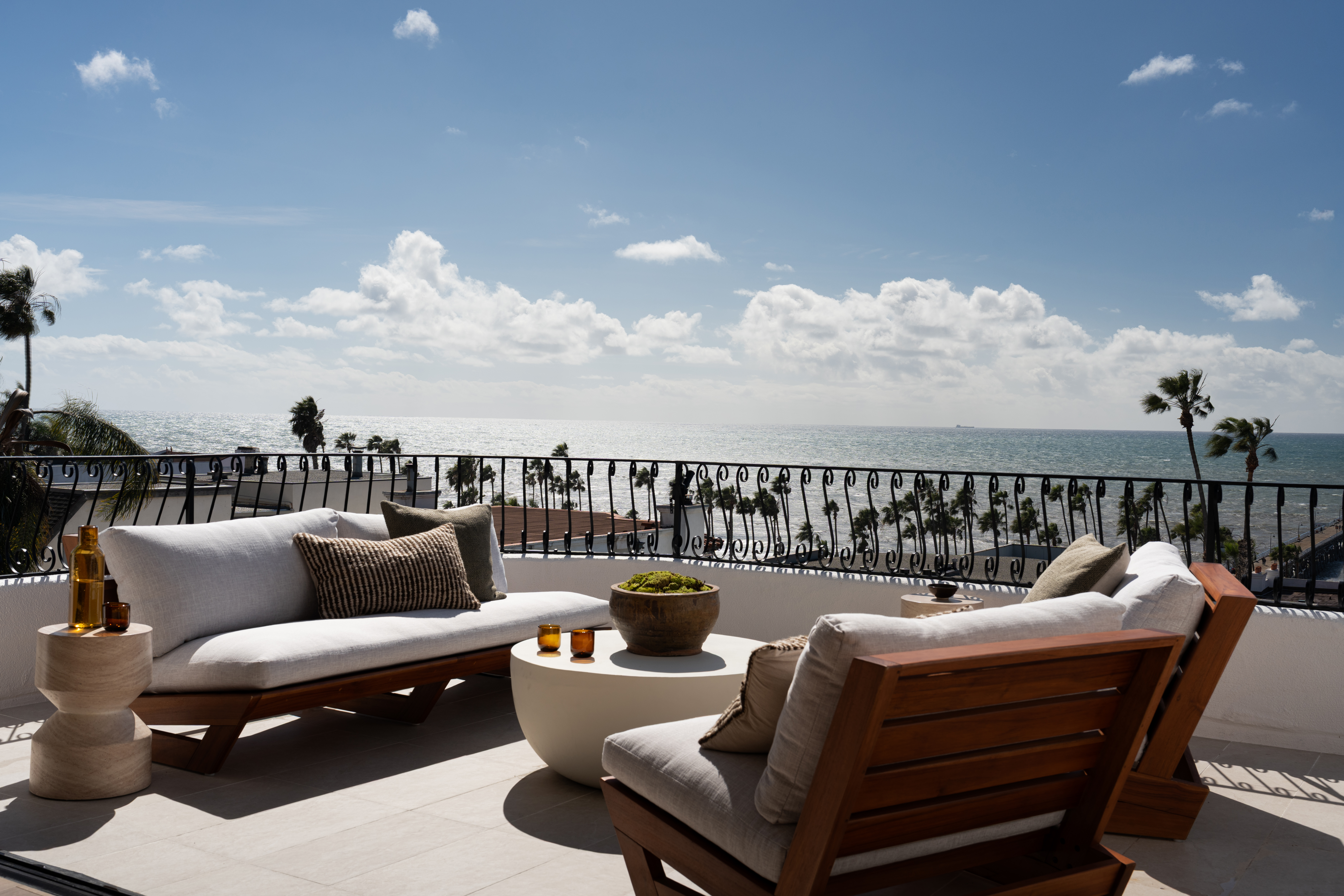 Modern outdoor balcony with seating and ocean view in South Harlow.