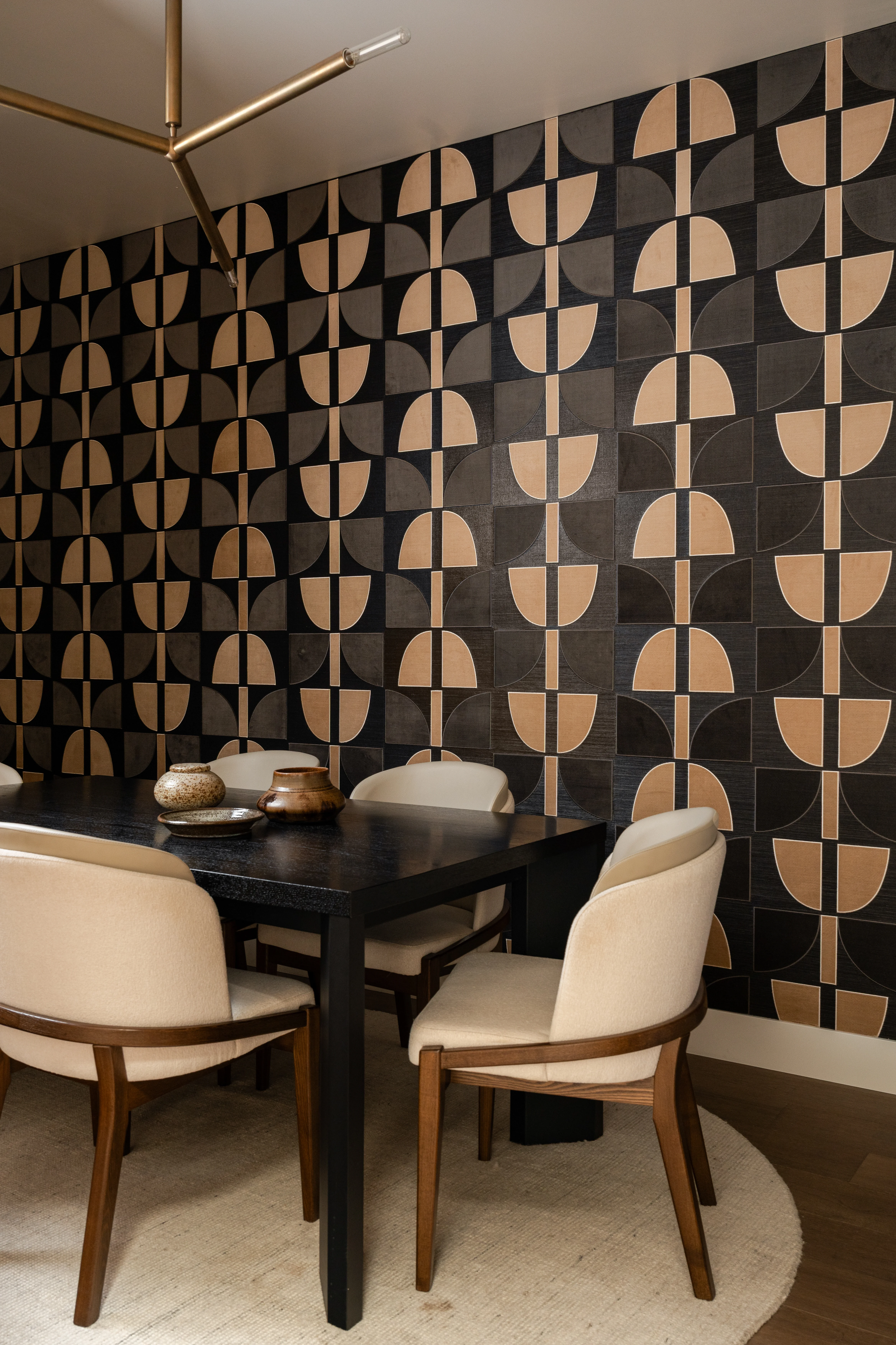 Graphic wallpaper and stone sink in an IOwn office powder room.