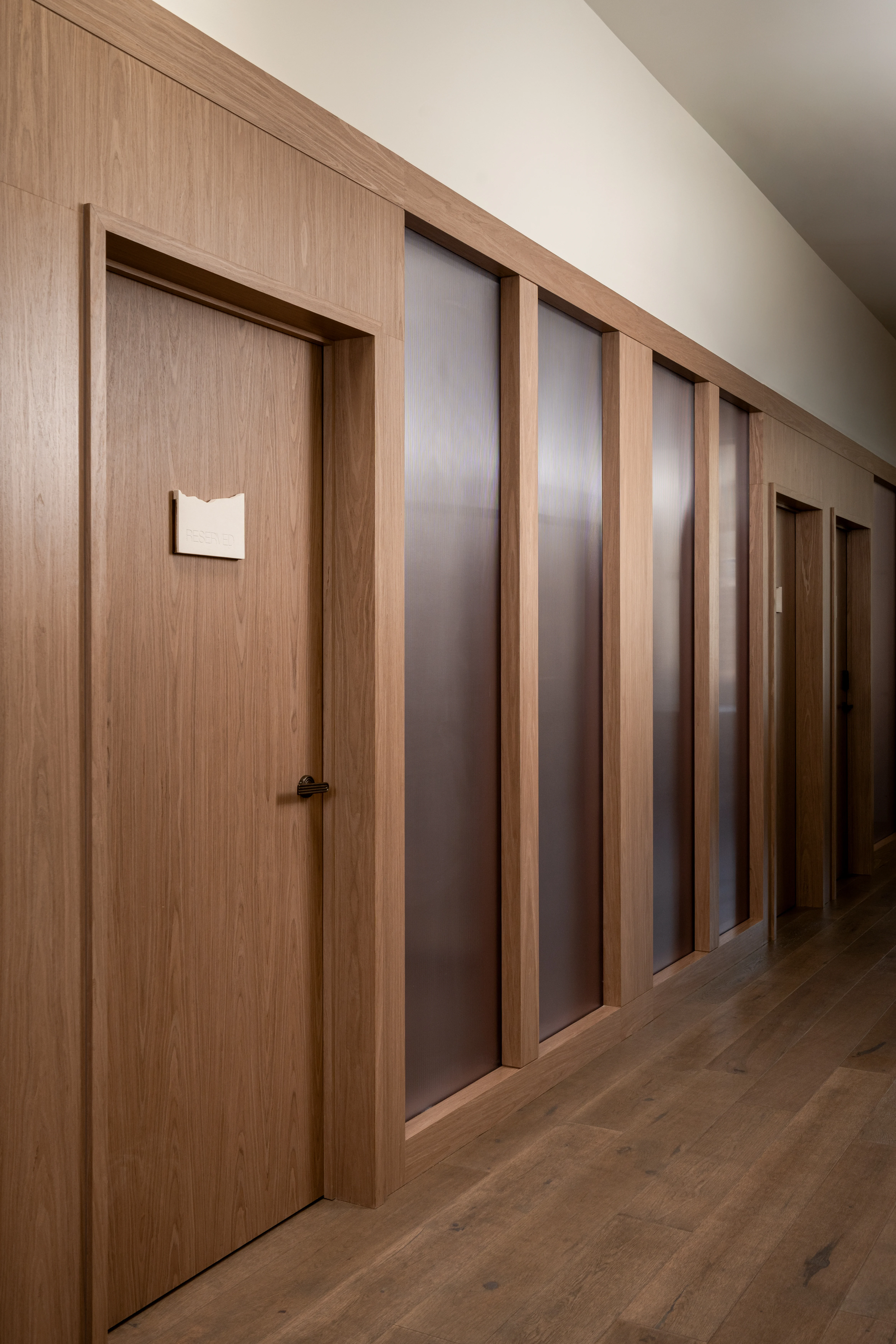Hallway lined with private telephone rooms.